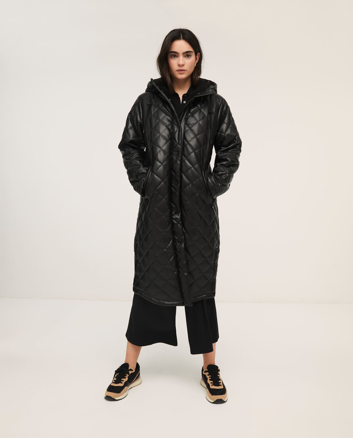 Quilted coat lined in shearling Black