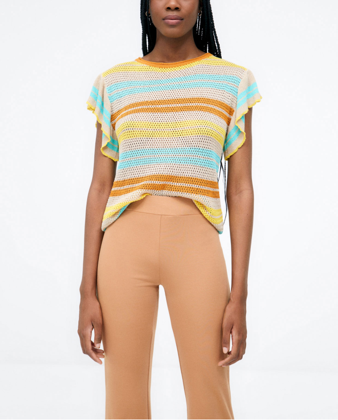 Long bell-bottom trousers. Elastic. Plain. Beige